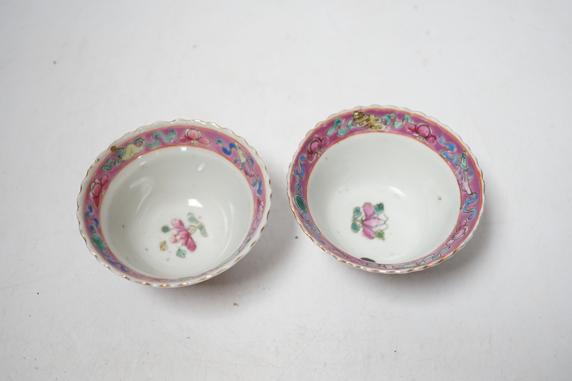 A pair of Chinese Straits famille rose pink ground bowls, Nonya ware, late 19th century, 5.5cm high